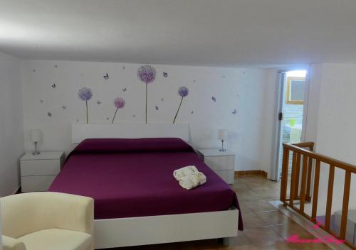 En eller flere senge i et værelse på Casa Vacanza Vieste In Centro - Maison del Borgo