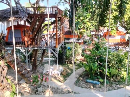 a tree house in the middle of a garden at Rommai Forest Bungalows in Ko Lanta