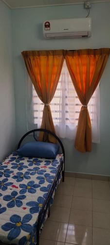 Ένα ή περισσότερα κρεβάτια σε δωμάτιο στο Chill Spot Homestay