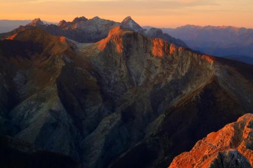 an aerial view of a mountain range at sunset at Villa Adelaide 22 Pax by VILLASRETREATS in Rometta