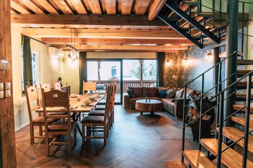 a living room with a table and a couch at Chata Margit - Margit-lak in Szalóc