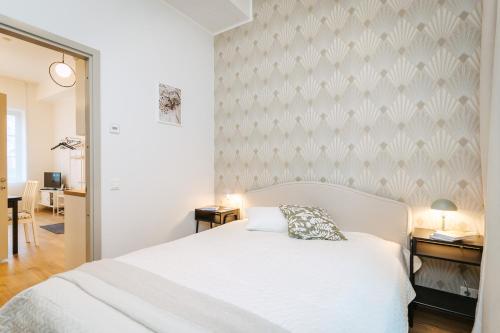 Ένα ή περισσότερα κρεβάτια σε δωμάτιο στο Krahviaia apartment