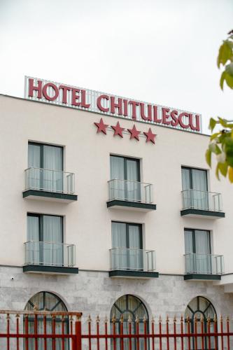 a hotel building with red stars on it at CHITULESCU Hotel in Târgovişte