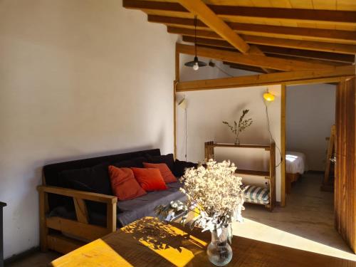 a living room with a couch and a table at Quinta dos Milagres Casa Terrassa in Friumes