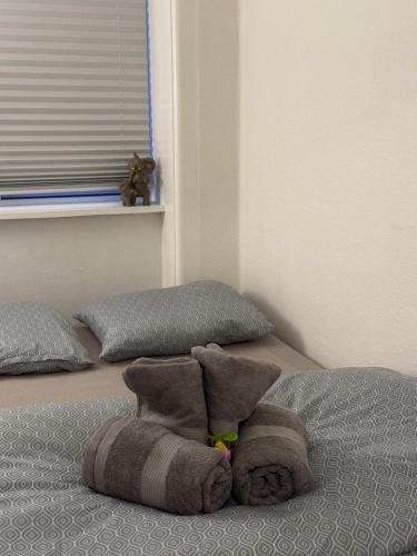 a bed with a towel on top of it at Cozy Copenhagen Getaway in Copenhagen