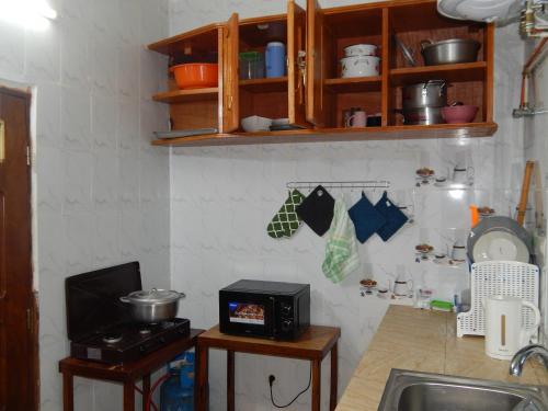 Nzing Apartmentsにあるキッチンまたは簡易キッチン