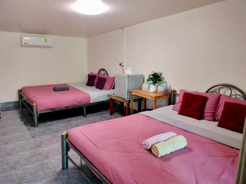 Postel nebo postele na pokoji v ubytování Kohmook​ Money​ House