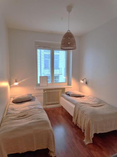 Postel nebo postele na pokoji v ubytování IM Apartments - with private jacuzzi and sauna in the heart of Vaasa