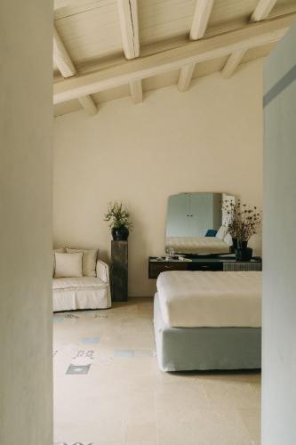 a living room with two beds and a couch at Dimora delle Balze in Noto
