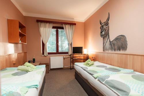 Postel nebo postele na pokoji v ubytování Hotel Rozkoš