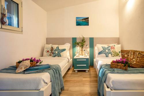 Letto o letti in una camera di SARDINIA RE - Porto Conte Bay Terrace
