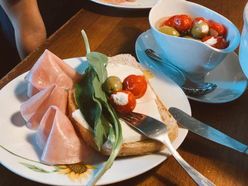 a plate of food with a sandwich on a table at DVOR 13 Hokovce in Hokovce