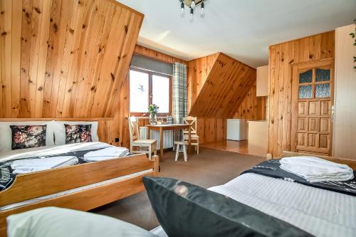 Ένα ή περισσότερα κρεβάτια σε δωμάτιο στο Tatra Slope & Spa