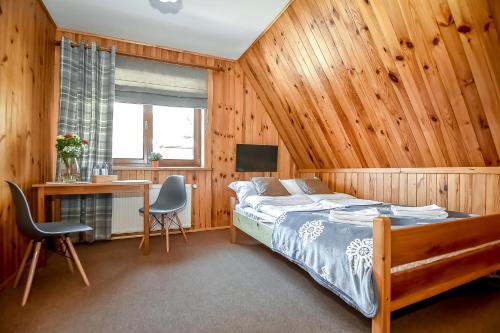 Ένα ή περισσότερα κρεβάτια σε δωμάτιο στο Tatra Slope & Spa