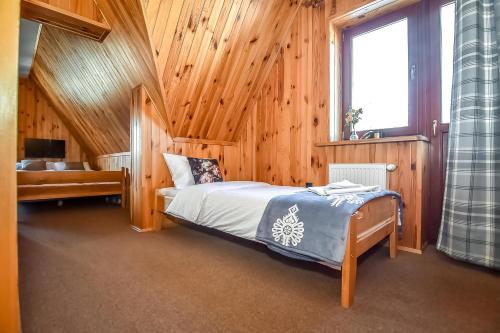 Ένα ή περισσότερα κρεβάτια σε δωμάτιο στο Tatra Slope & Spa