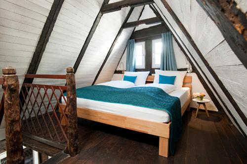 a bedroom with a large bed in a attic at 1463 Apartmenthaus in Karlsruhe