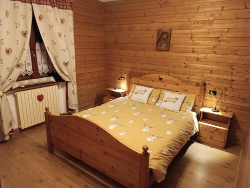 Postel nebo postele na pokoji v ubytování La Casa Rossa - Presolana