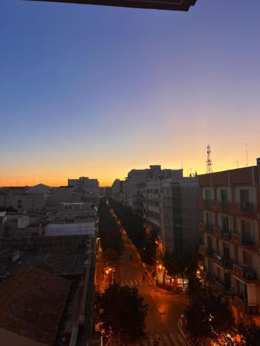a view of a city at sunset with buildings at In Cavour 127 in Andria