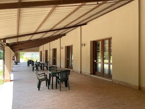 a group of tables and chairs on a patio at Agriturismo Casari in Quistello