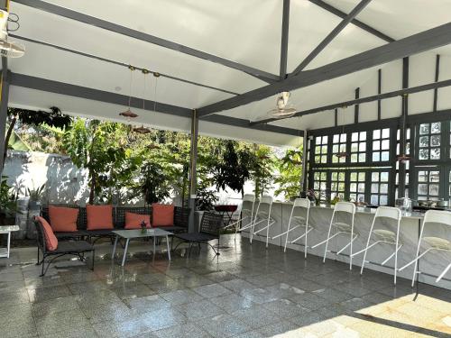 a tent with chairs and tables in a building at Garden House Rice Field and Mountain View in Luang Prabang