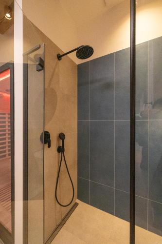 a bathroom with a shower with a shower head at Reethus 22 Loft 7 in Timmendorfer Strand