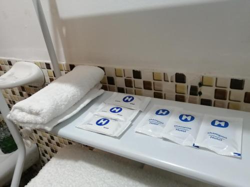 a shelf in a bathroom with towels on it at Magnolia Andina in Cusco