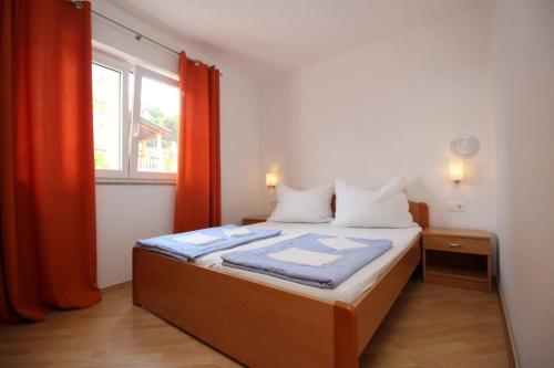 Postel nebo postele na pokoji v ubytování Apartments Mikulan Nara