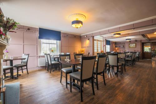 a dining room with tables and chairs at Stallingborough Grange Hotel in Stallingborough