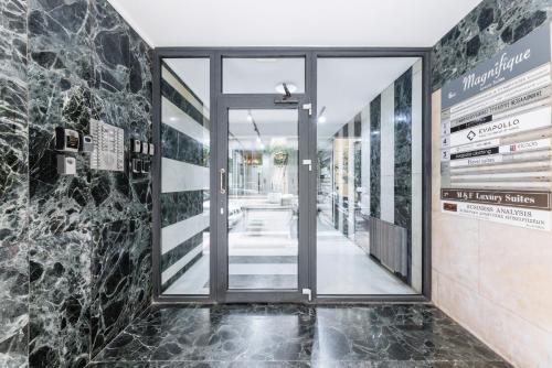 an entrance to a building with a revolving door at B&M Suites in Thessaloniki