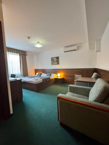 Posteľ alebo postele v izbe v ubytovaní Hotel Barbakan