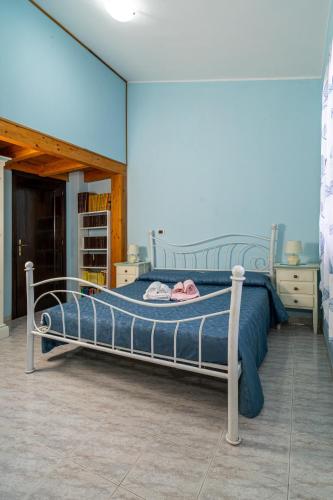 Postel nebo postele na pokoji v ubytování Casa Vacanze Cala Sapone