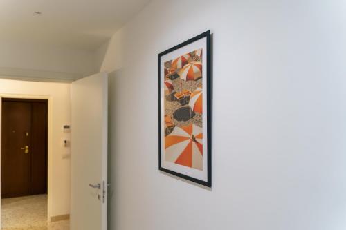 a framed painting on a wall in a hallway at Domus-Pulchra in Bari
