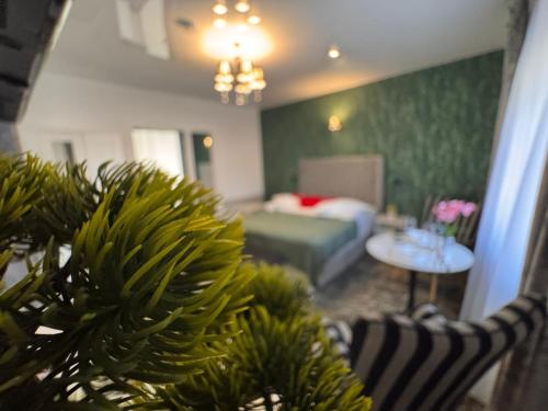 a living room with a bed and a couch at Premont Luxury Ghimbav in Ghimbav