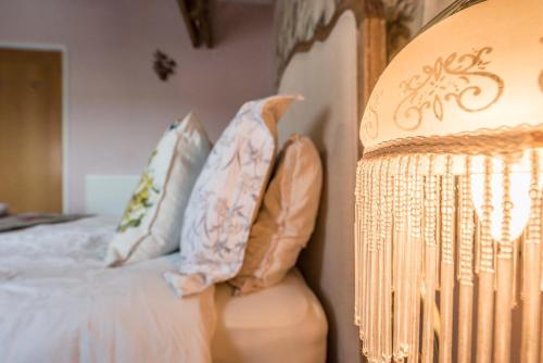 a bedroom with a bed with pillows at Ocean View, Lowestoft in Lowestoft