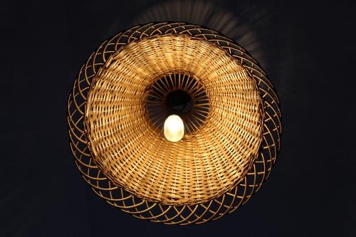 a wicker basket with a light on top of it at Dom Pracy Twórczej Macondo in Miedzno