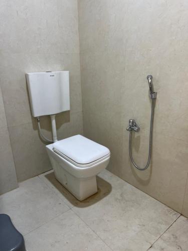 a bathroom with a toilet and a shower at Star STAY in Aurangabad