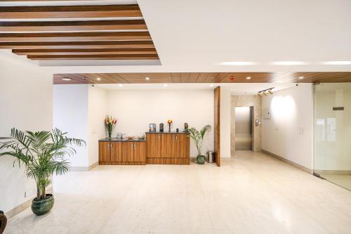 an empty lobby with a counter in a building at FabHotel La Paz Stay B&B in New Delhi