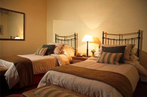 מיטה או מיטות בחדר ב-Robles de Besares