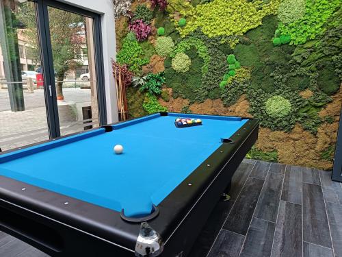 a pool table in front of a wall at Hotel Bernarda in Varaždinske Toplice