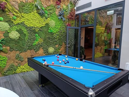 a pool table in front of a wall at Hotel Bernarda in Varaždinske Toplice