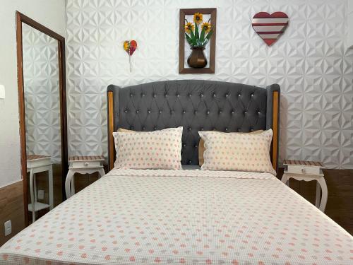 Una cama o camas en una habitación de Pousada Cascata dos Amores