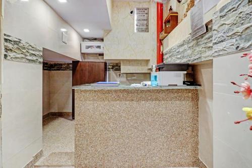 a kitchen with a counter top in a room at New Green Plaza in New Delhi