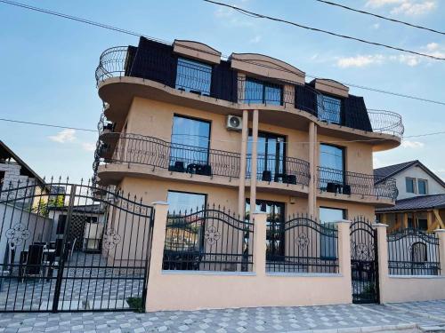 a building with balconies on the side of it at Vila Sephora in Eforie Nord