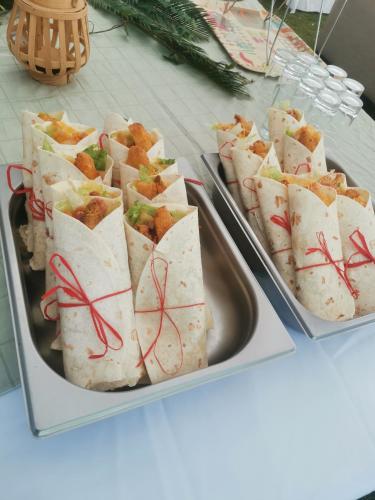 two trays of wrap sandwiches on a table at A Cherry Lane Self Catering and B&B in Bloemfontein