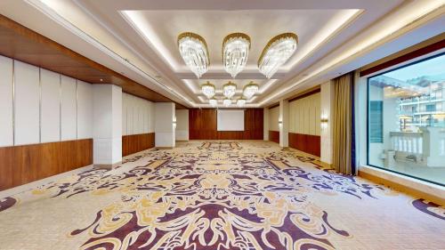 a large room with a large rug on the floor at Radisson Collection Hotel & Spa, Riverfront Srinagar in Srinagar