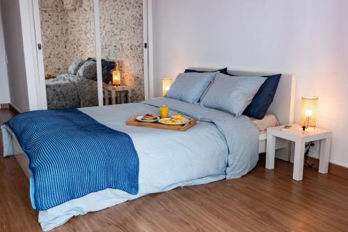 Postel nebo postele na pokoji v ubytování Caparica Beachfront Oceanview