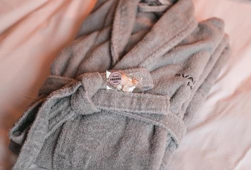a toy cat is inside of a gray towel at Svalbard Hotell | Polfareren in Longyearbyen
