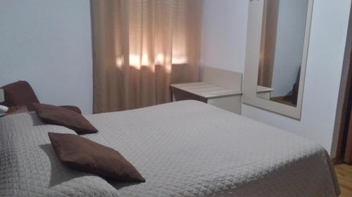 Ένα ή περισσότερα κρεβάτια σε δωμάτιο στο Hotel Ariston