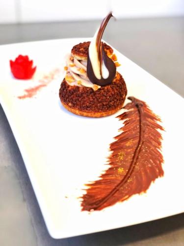 a dessert on a white plate on a table at Propstei Sankt Gerold in Blons