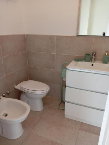 a bathroom with a toilet and a sink at Affittacamere Lusitana Alloggi 2 in Foligno